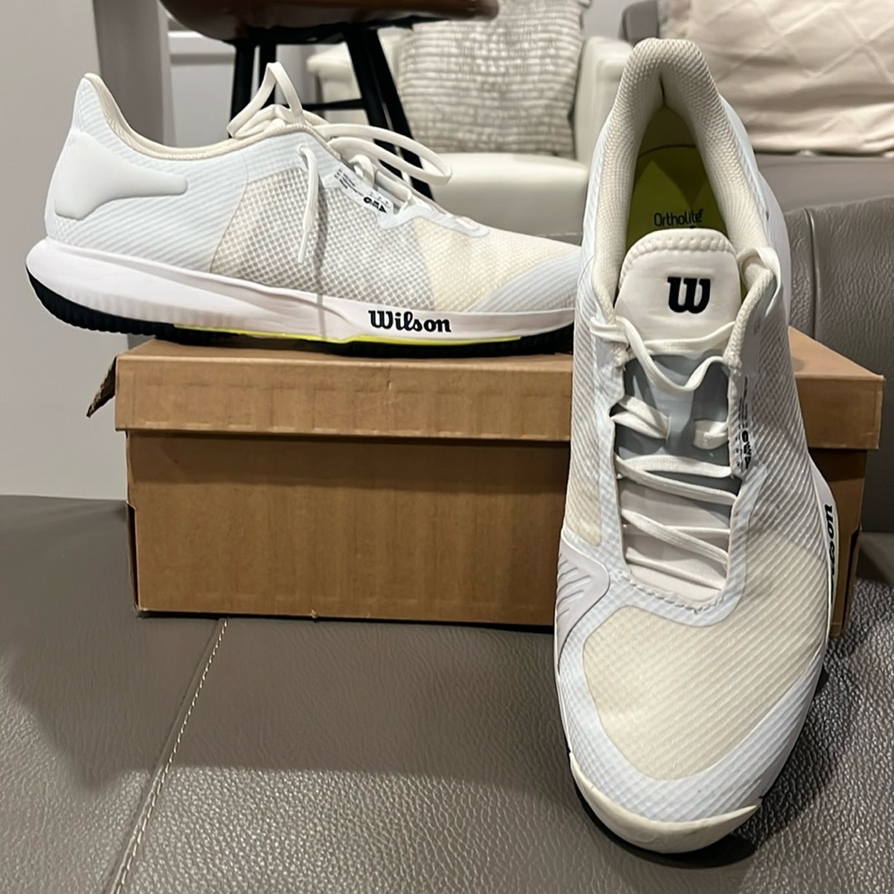 A great pair of running,tennis shoes. All white with grey accents throughout.